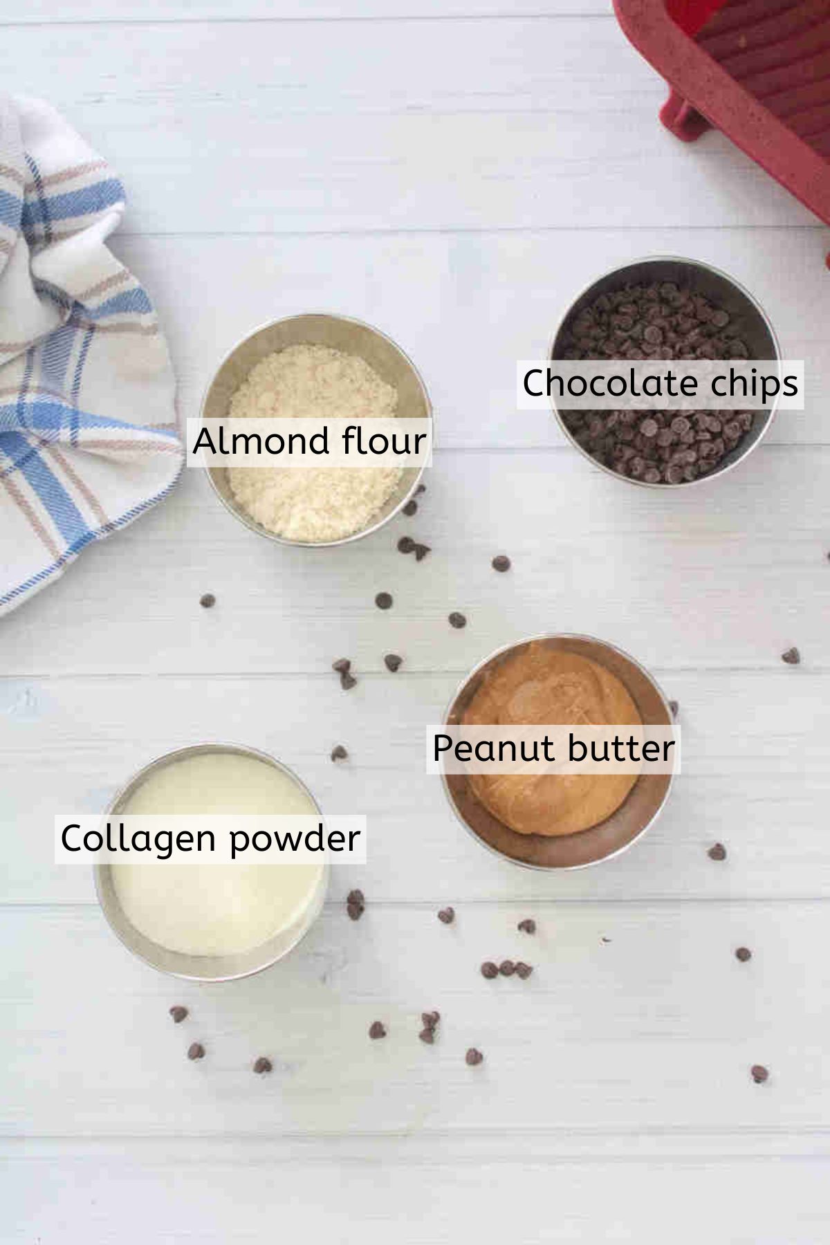 almond flour, chocolate chips, collagen powder, and peanut butter with text label on top of each ingredient