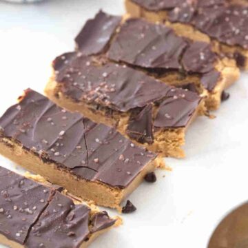 Sliced frozen peanut butter chocolate bars in a row.