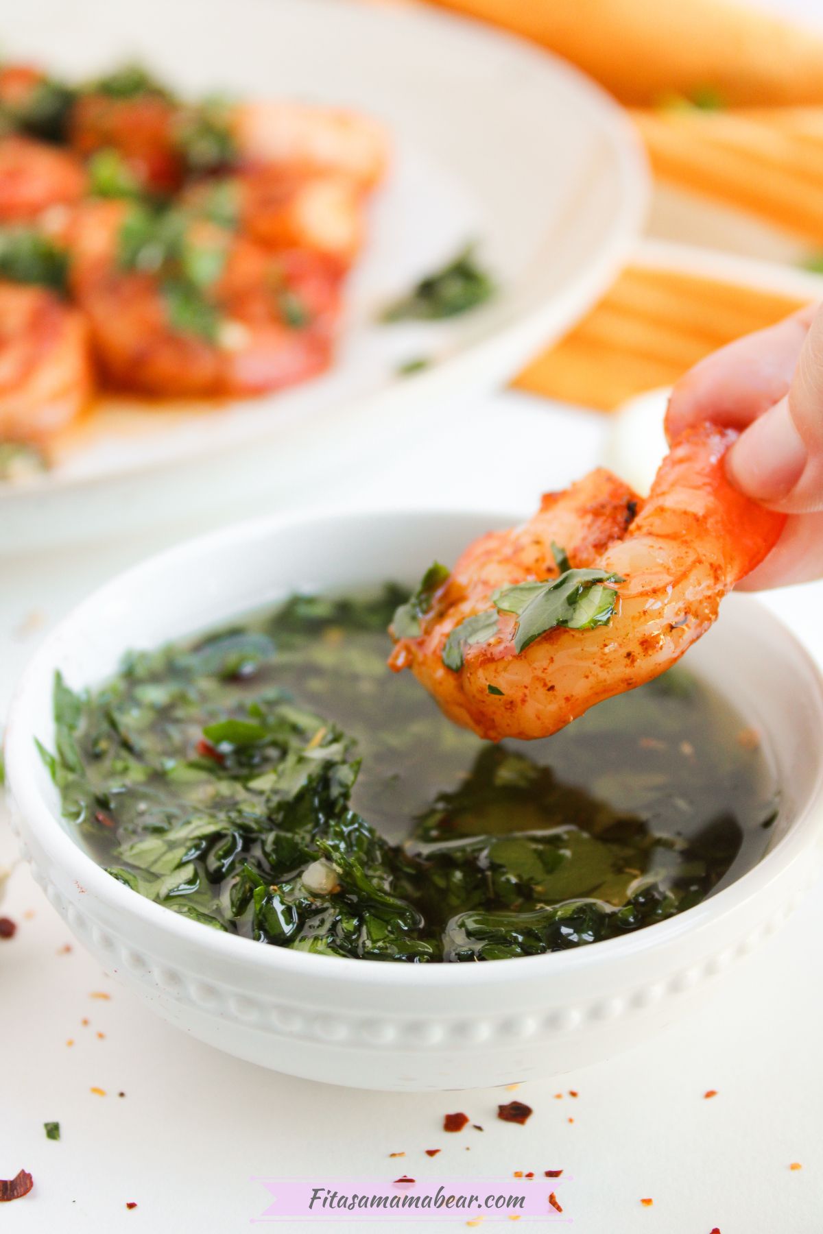 pan seared shrimp with a bowl of chimichurri sauce