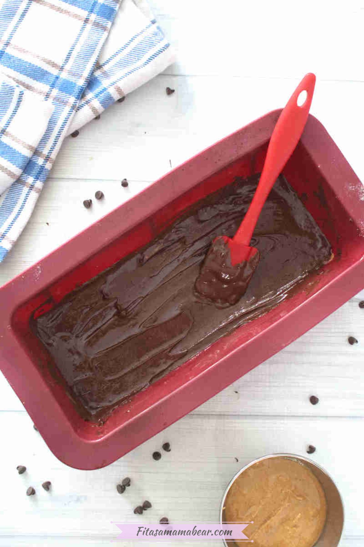 melted chocolate chips poured on top of peanut butter mixture