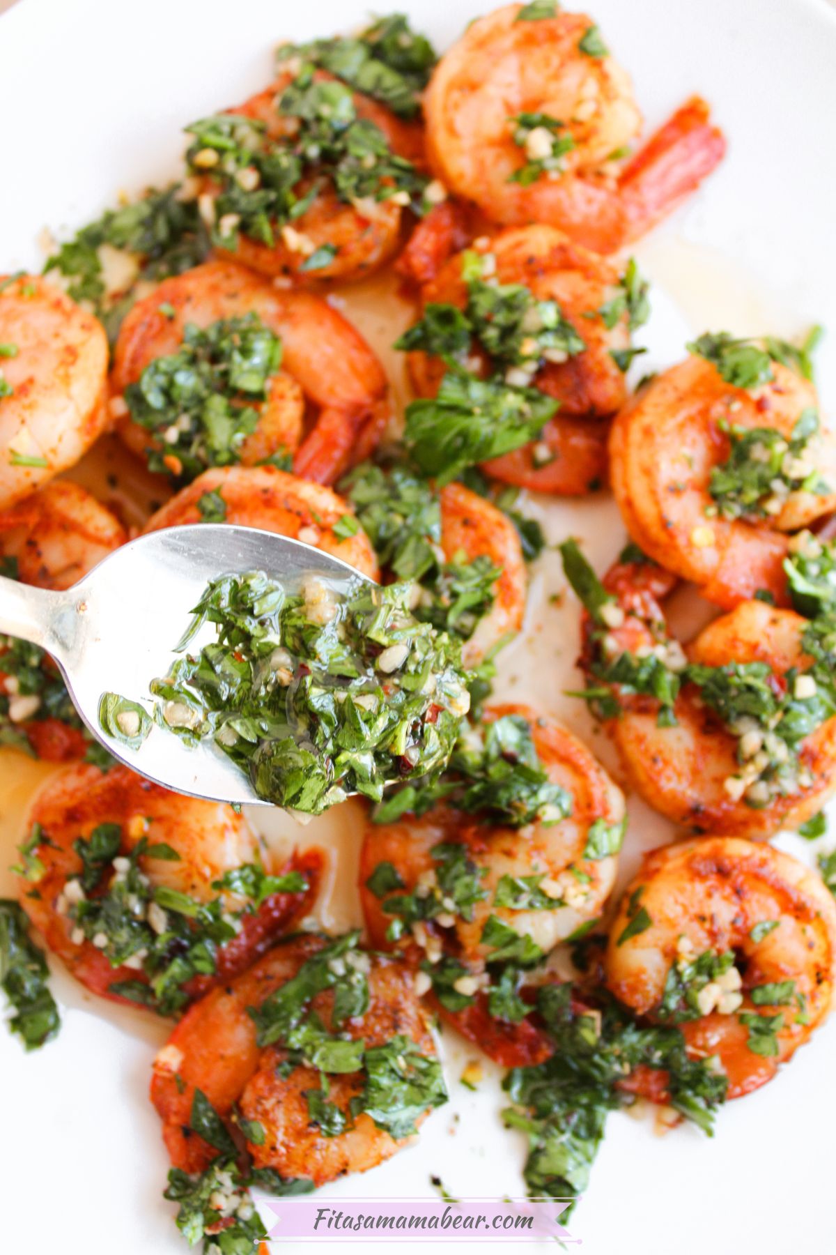 pan-seared shrimps on a plate served with chimichurri sauce