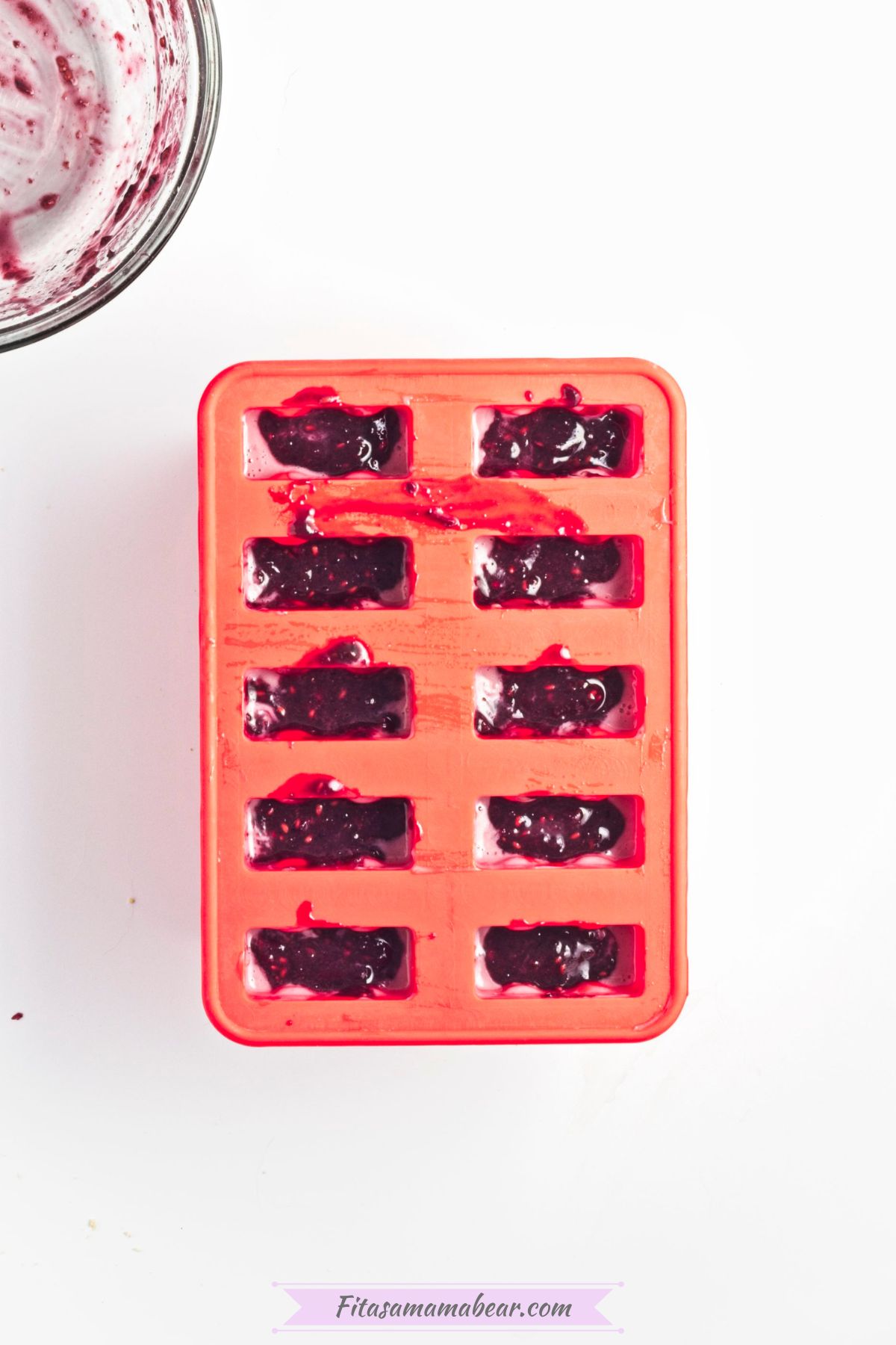 blended blackberries popsicle mixture in popsicle molds