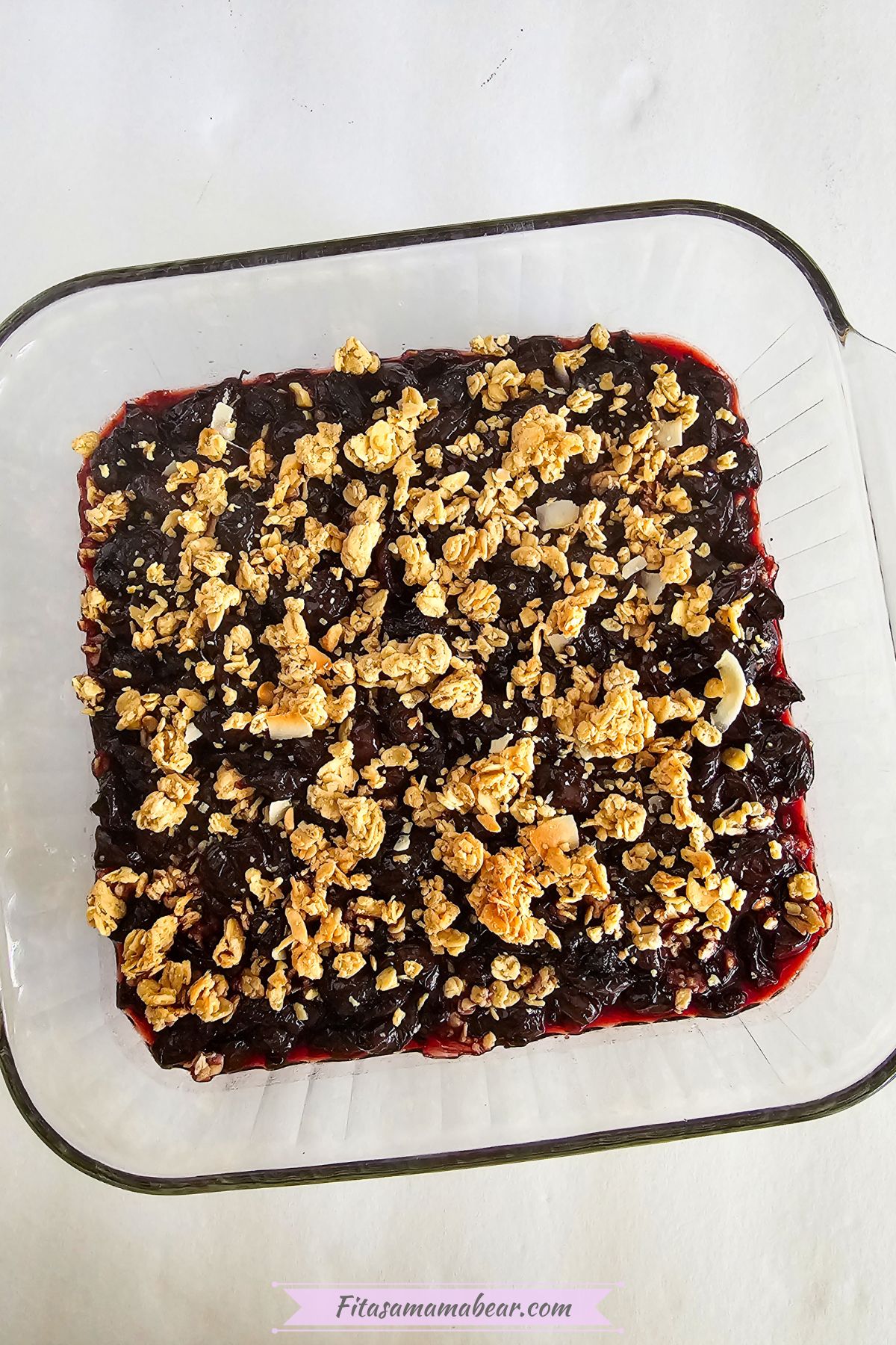 baked cherry granola in a baking dish