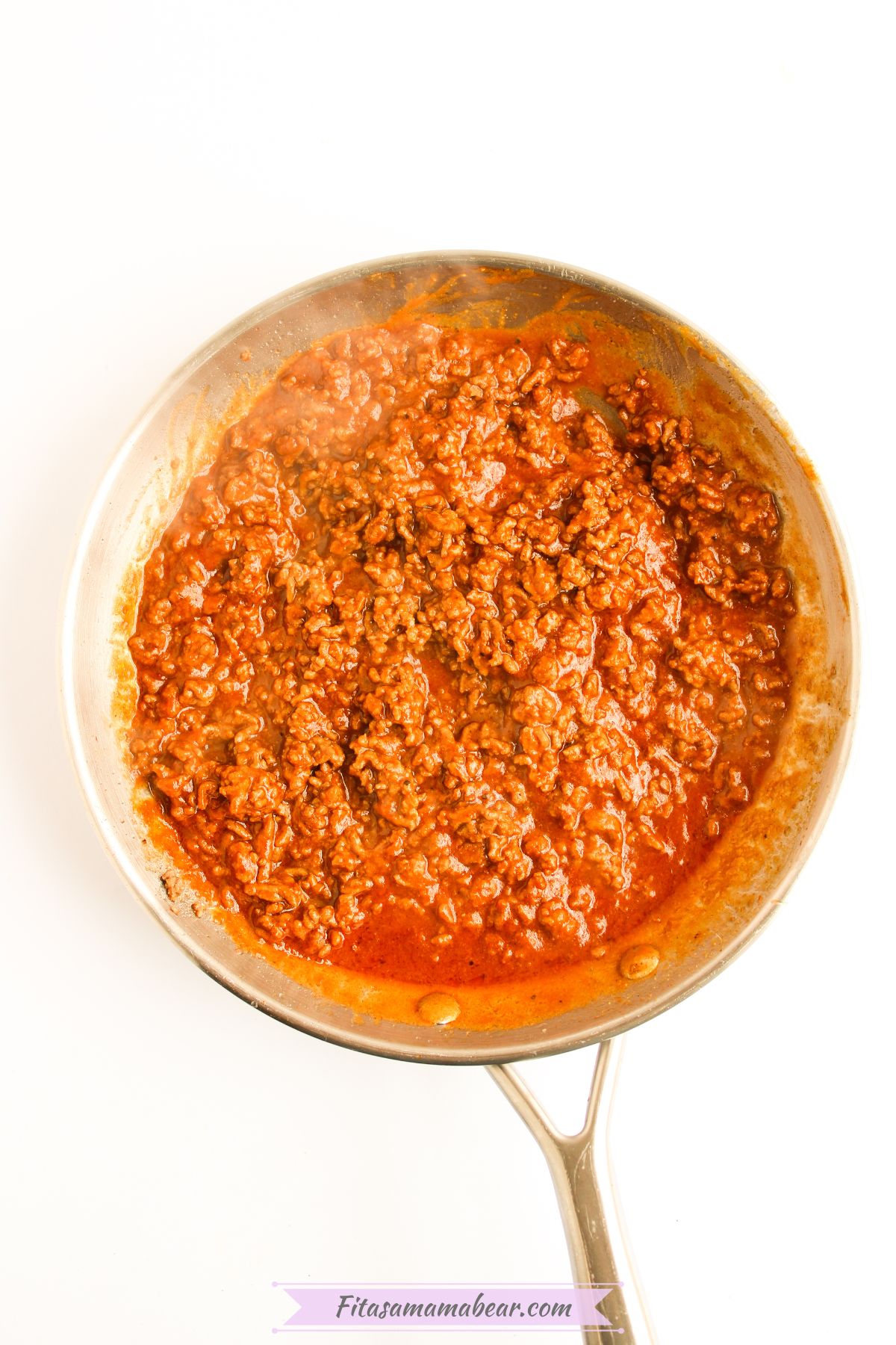 Cooked ground beef mixed with sauce and seasonings.