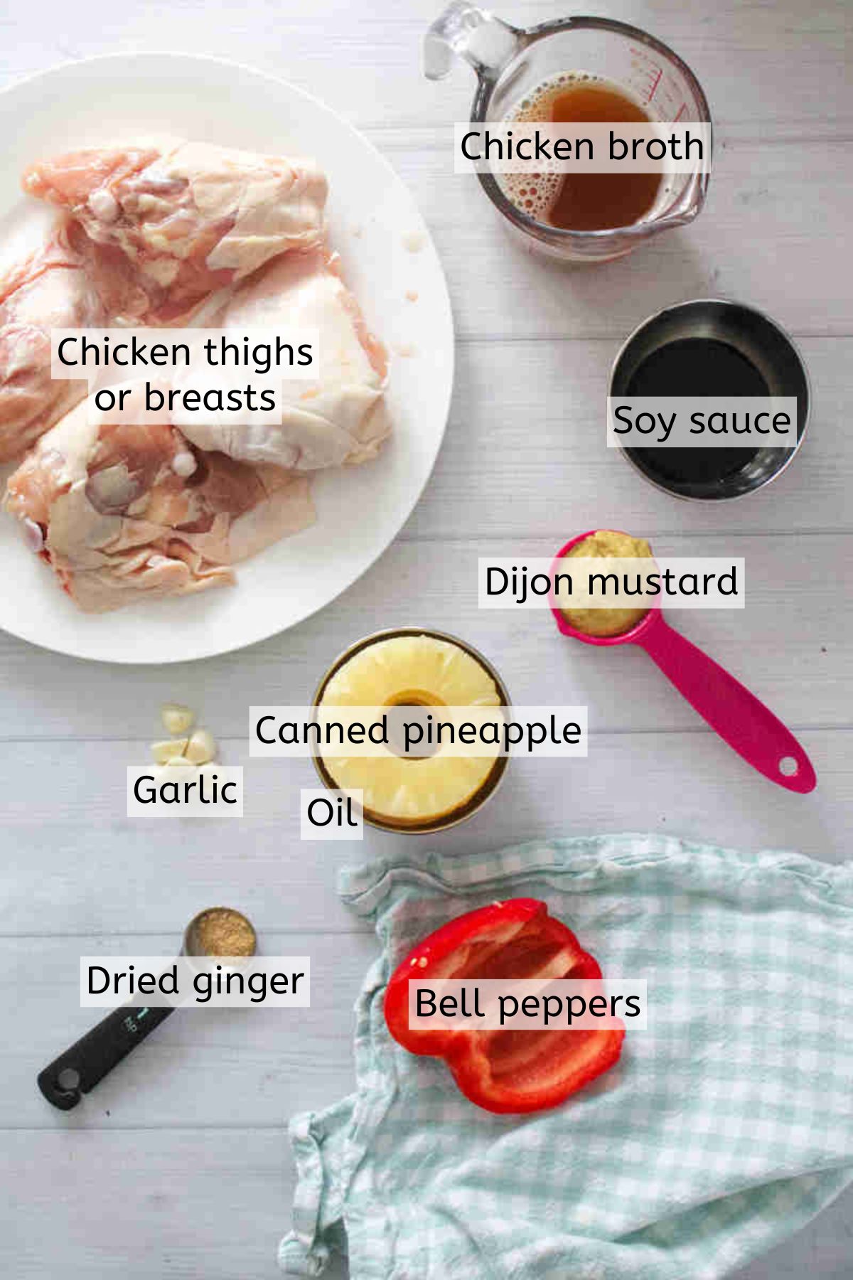 Raw chicken, chicken broth, soy sauce, mustard, canned pineapple rings, oil, garlic, ginger powder, and bell peppers with text on top.