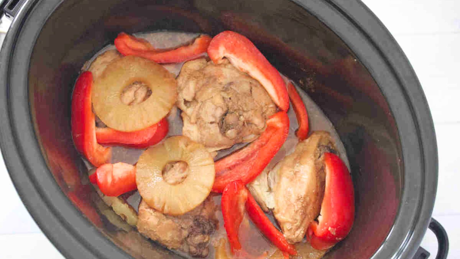 Slow cooker Hawaiian chicken inside a crockpot.