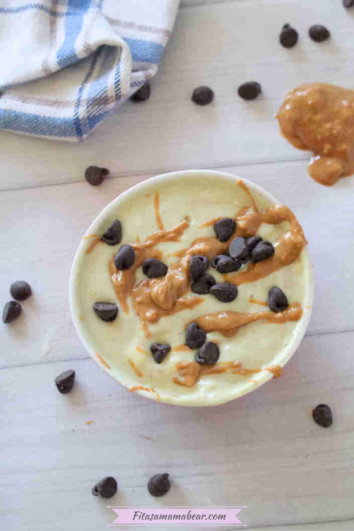 Greek yogurt protein pudding with chocolate and peanut butter swirls in a bowl.