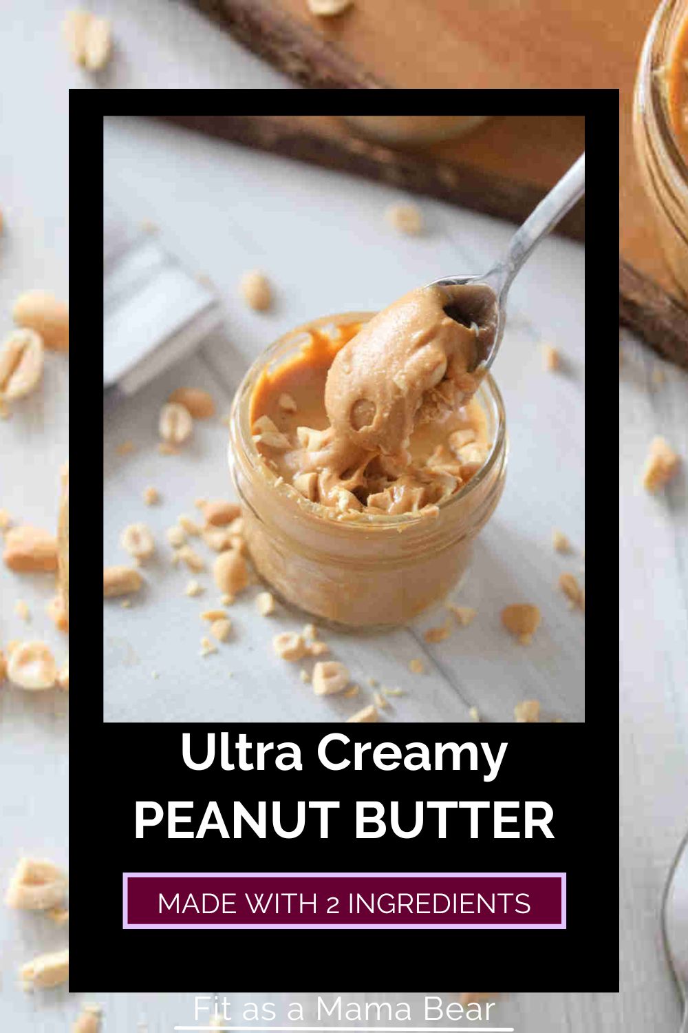 Homemade peanut butter in a mason jar topped with peanuts and a spoon and text on the image.