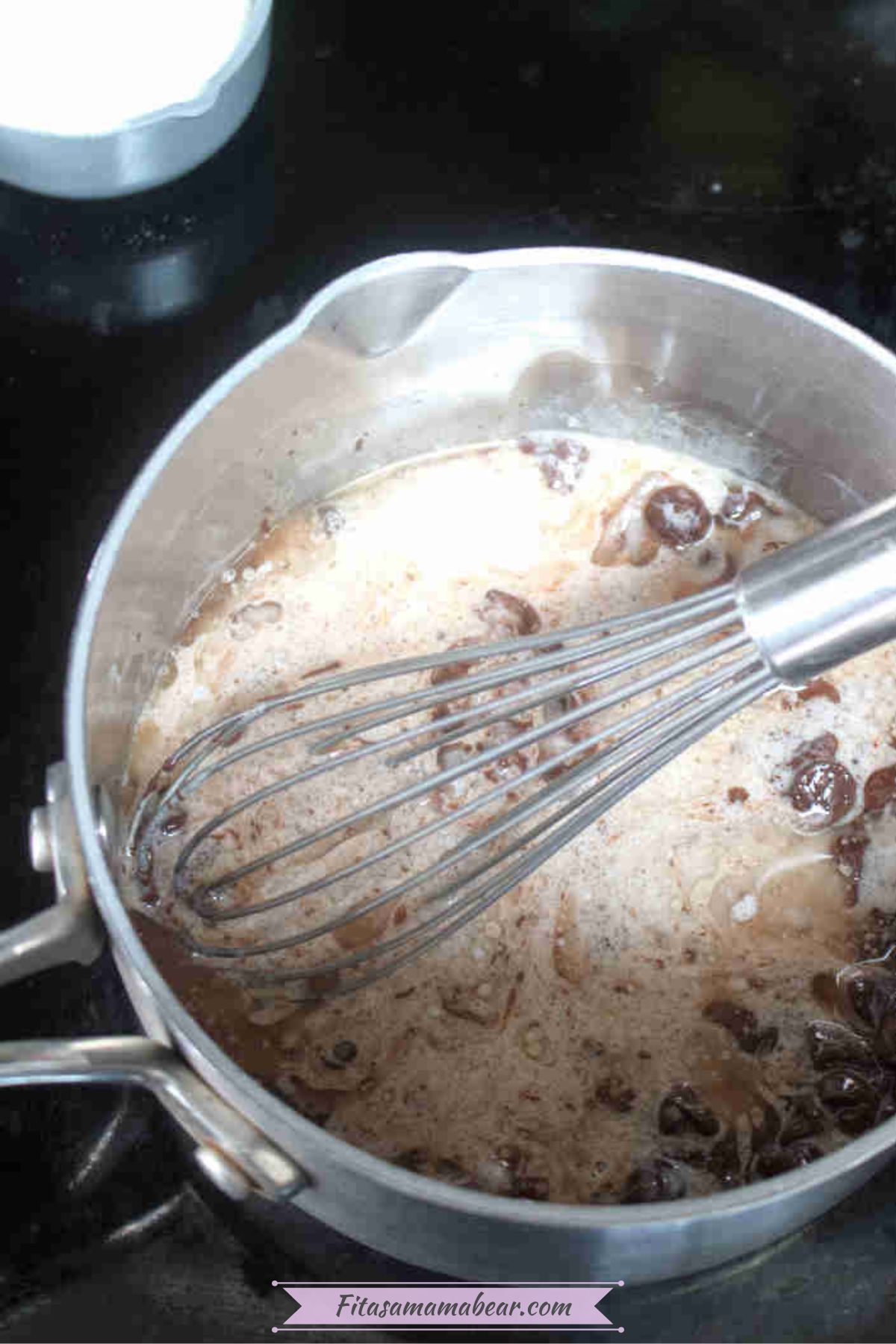 Whisk in a pot on the stove with coconut milk and melted chocolate.