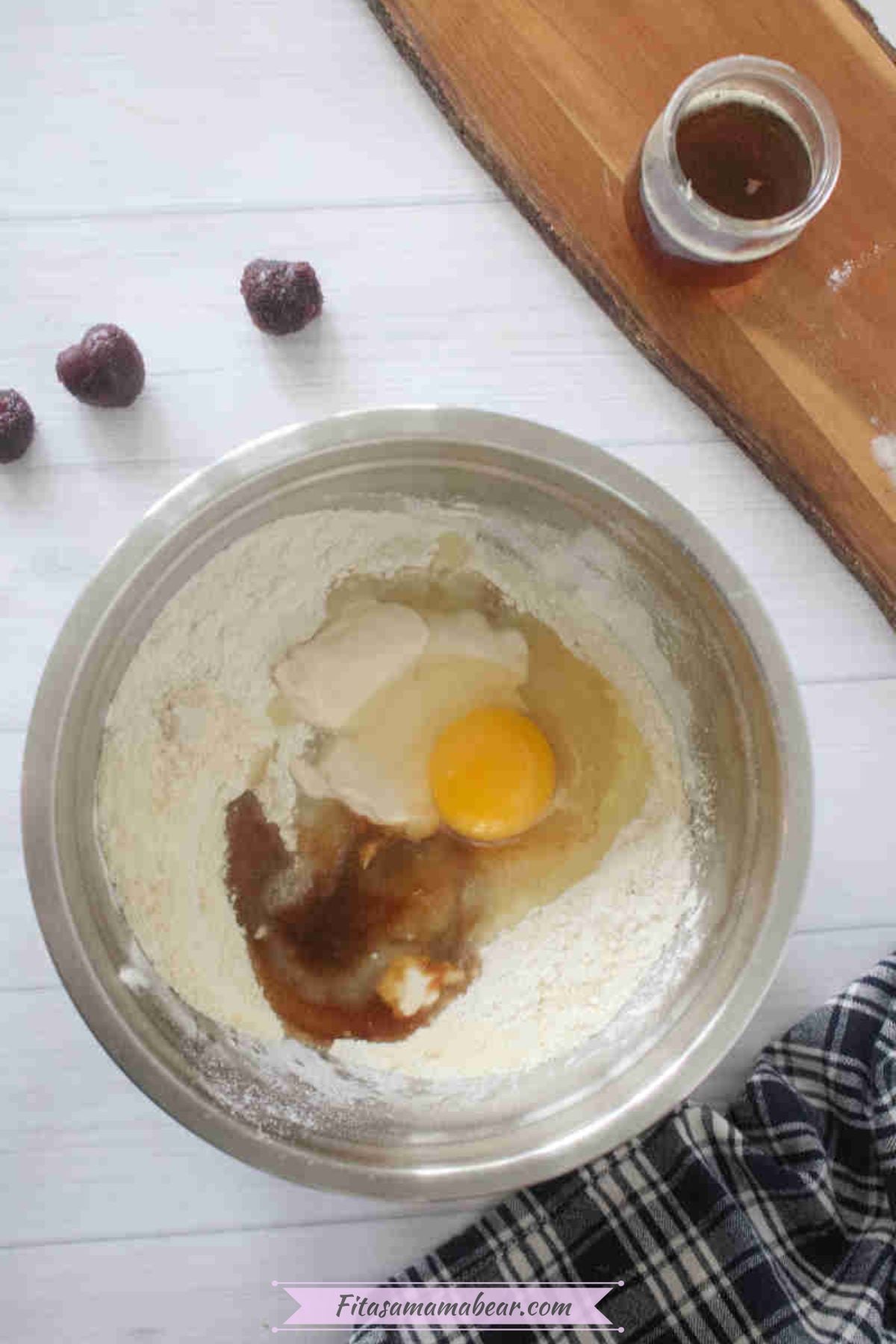 Flours, egg, and vanilla in a steel bowl.