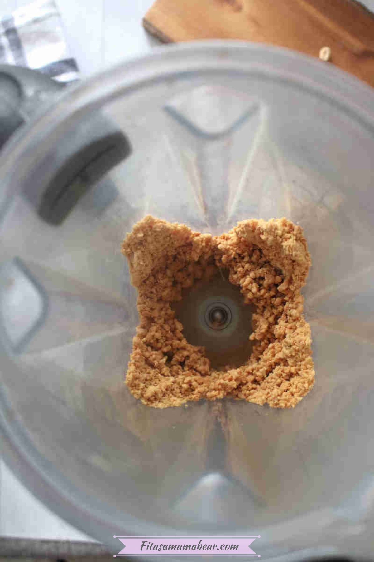 Chopped peanuts churning in a blender.