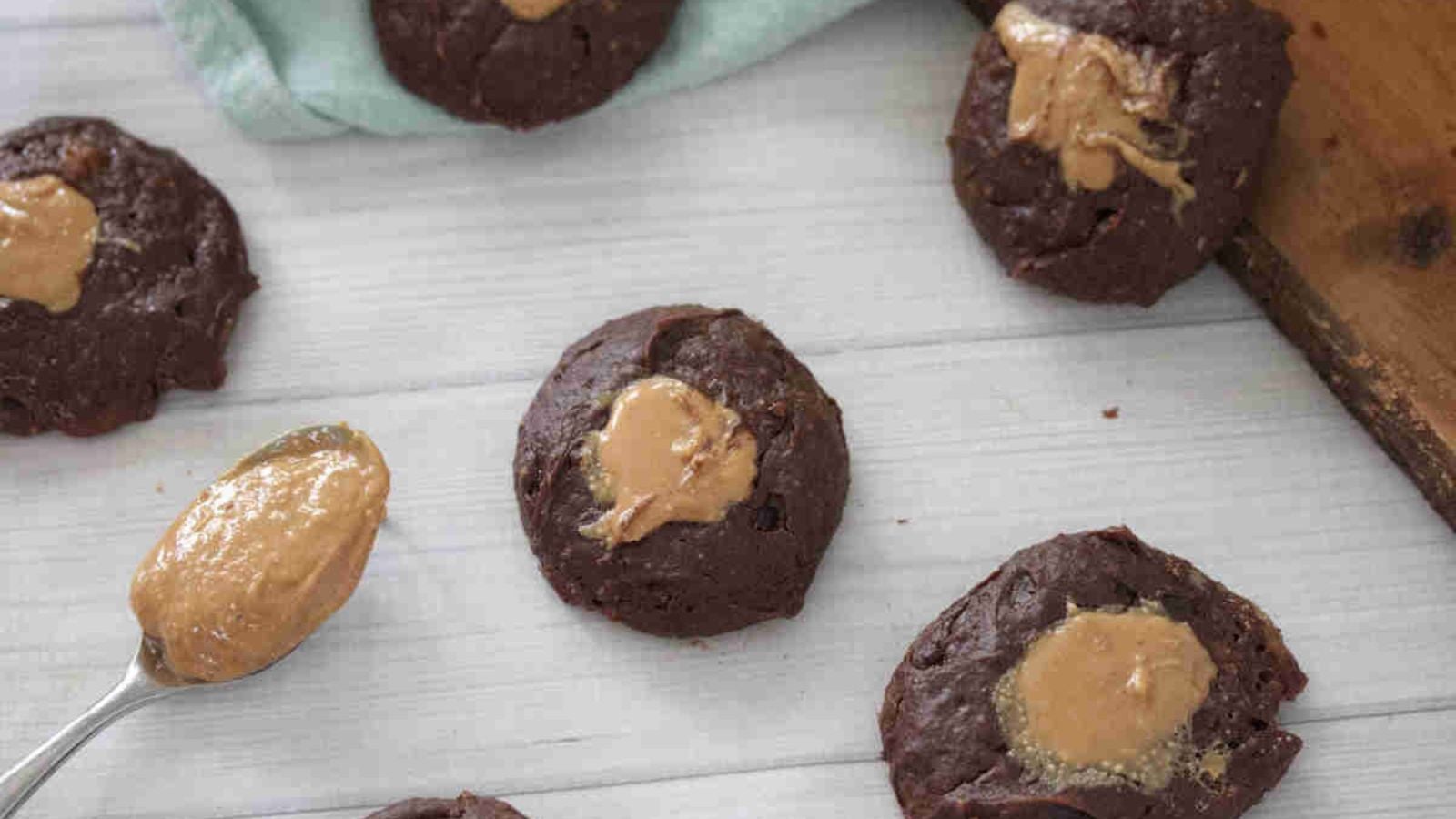 Baked chocolate yogurt cookies with peanut butter toppings.