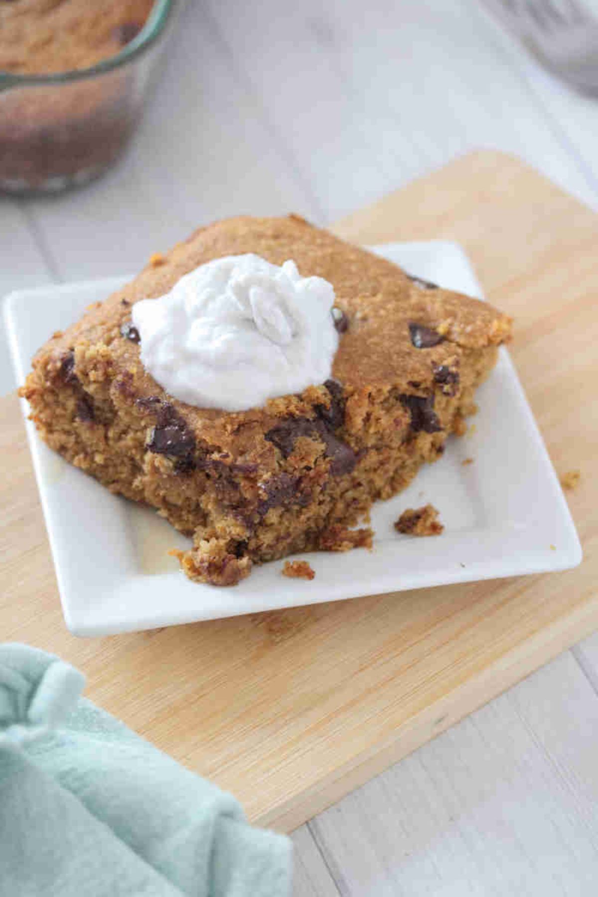 A slice of baked pumpkin oats on a plate.