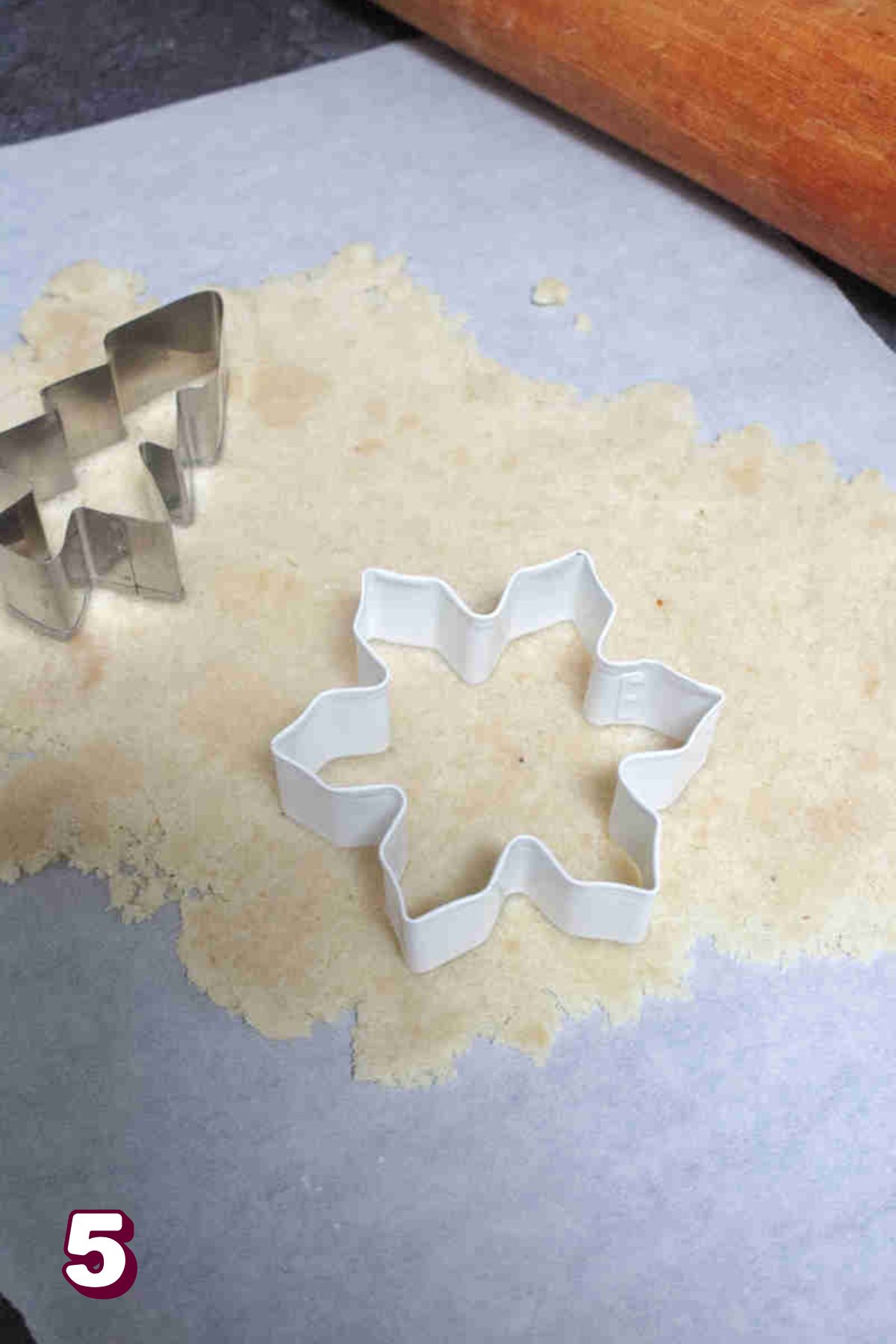 Gluten-free sugar cookies being cut out.
