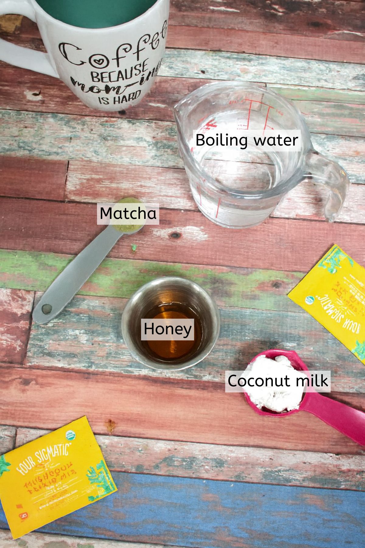 Ingredients like honey, coconut milk, and matcha in measuring cups with text labels over top.