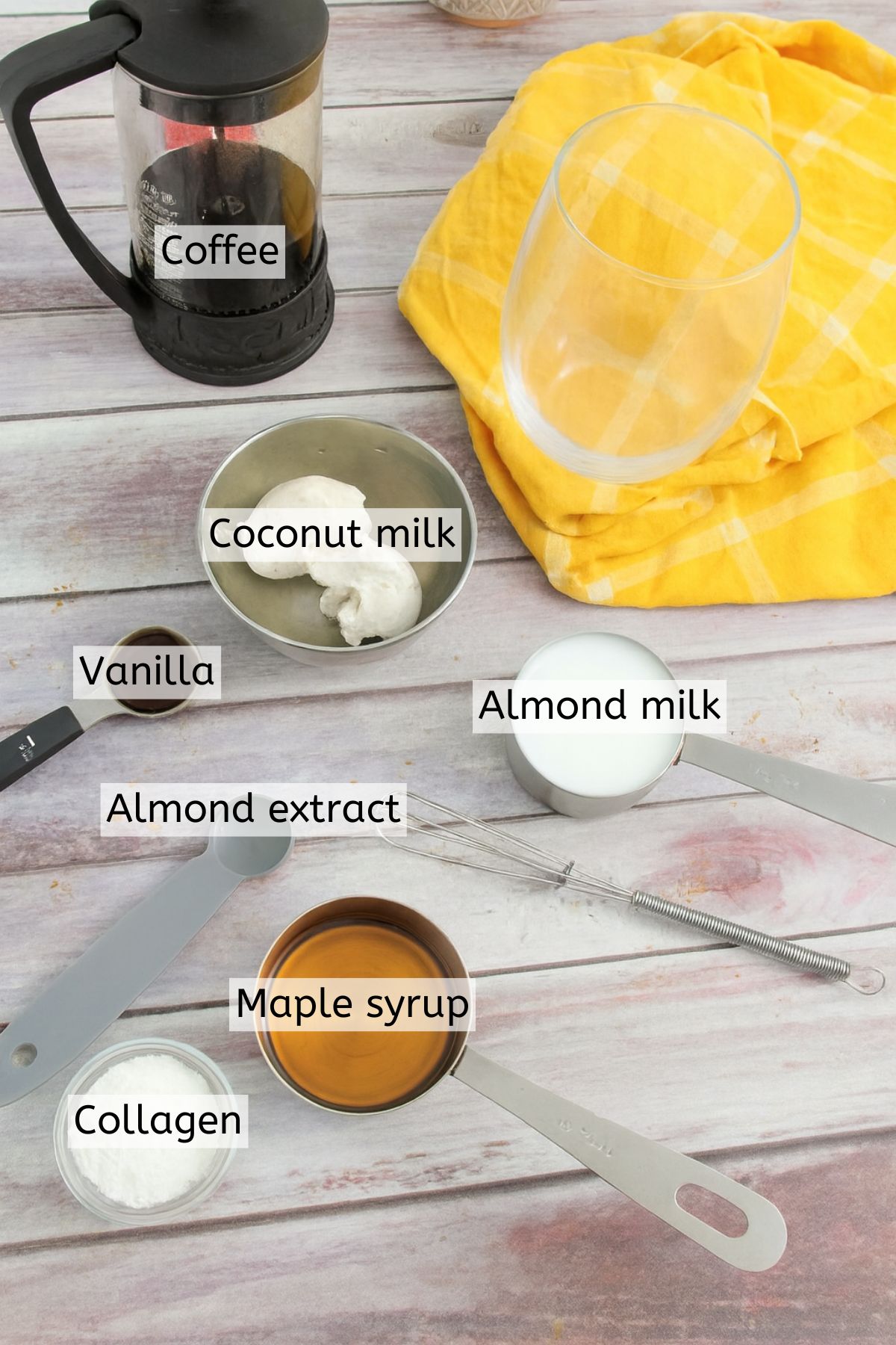 Ingredients like coffee, coconut milk, and collagen powder in measuring cups with text labels over top.