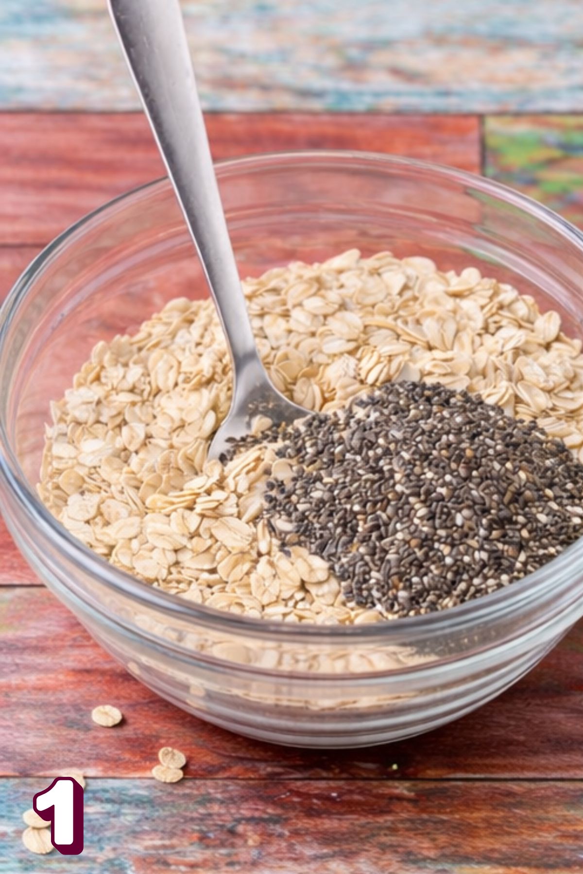 A glass jar with rolled oats and chia seeds.