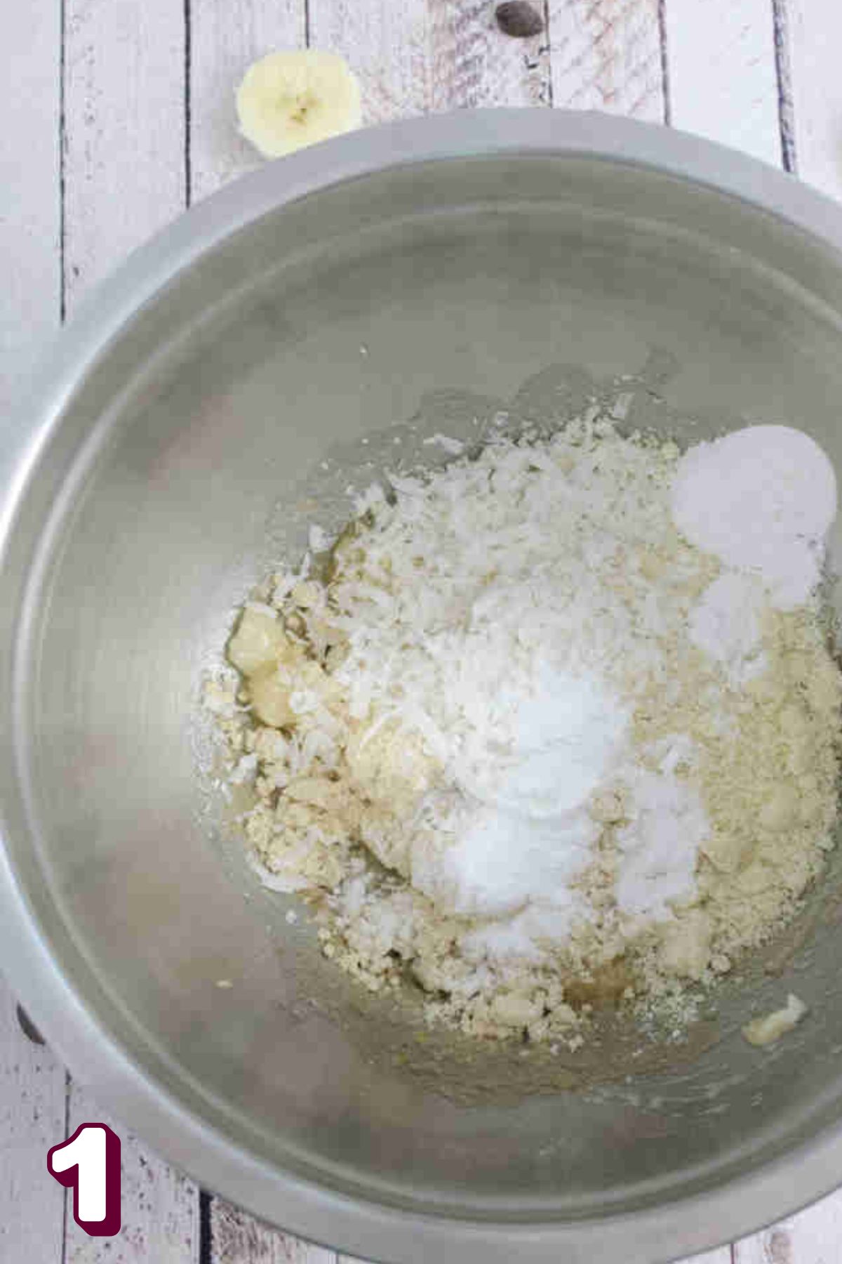 Dry ingredients for almond flour pancakes in a steel bowl.