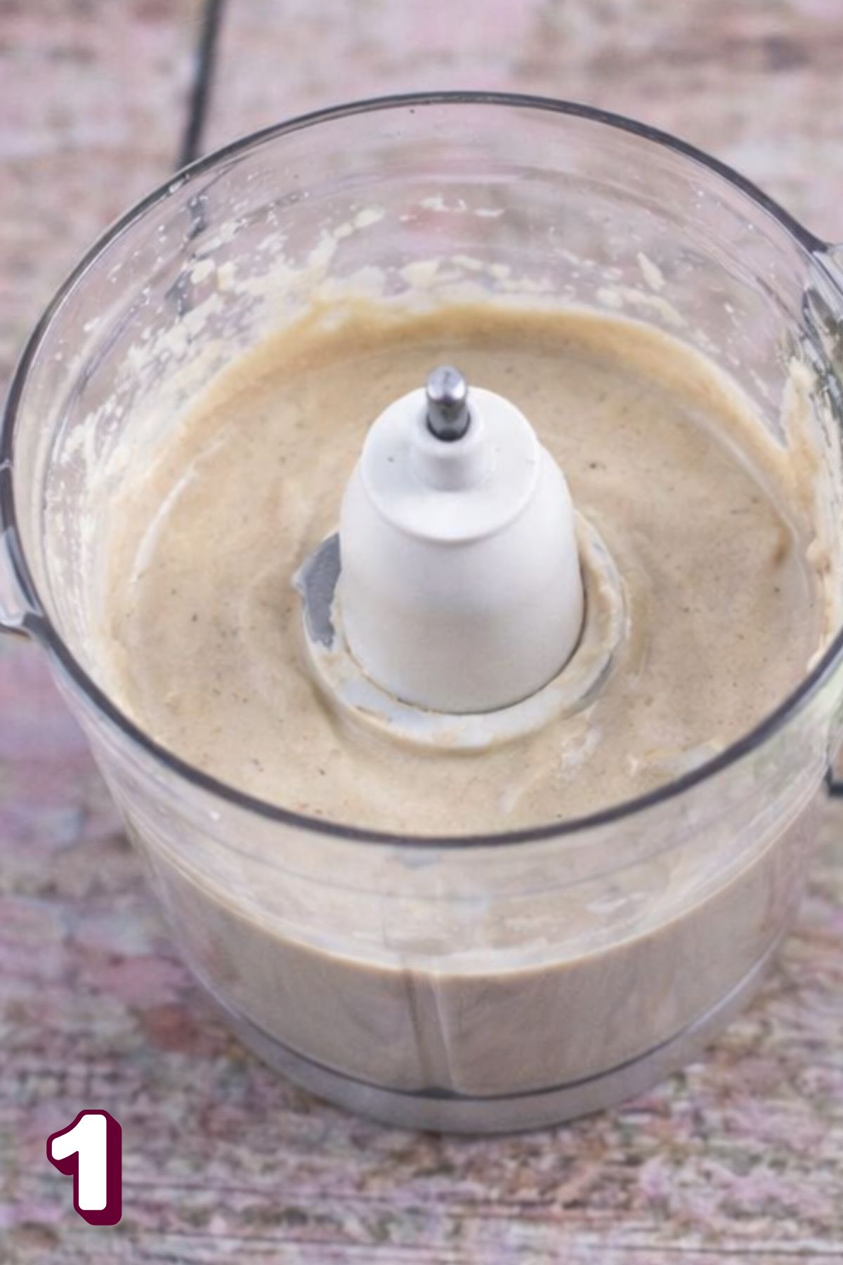 Creamy tahini dressing in a food processor.