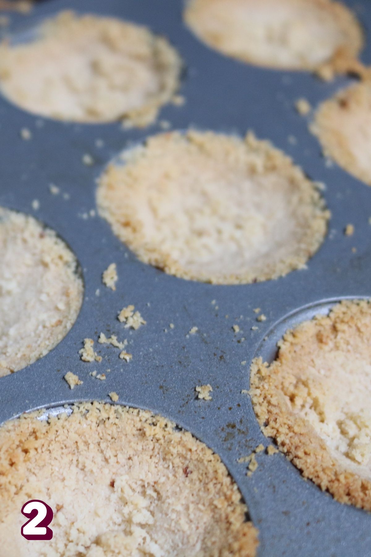 Almond flour crust in a mini muffin tin.