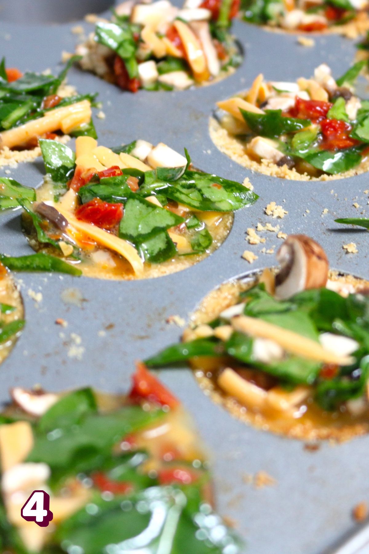 Mini dairy-free quiche in a muffin tin.