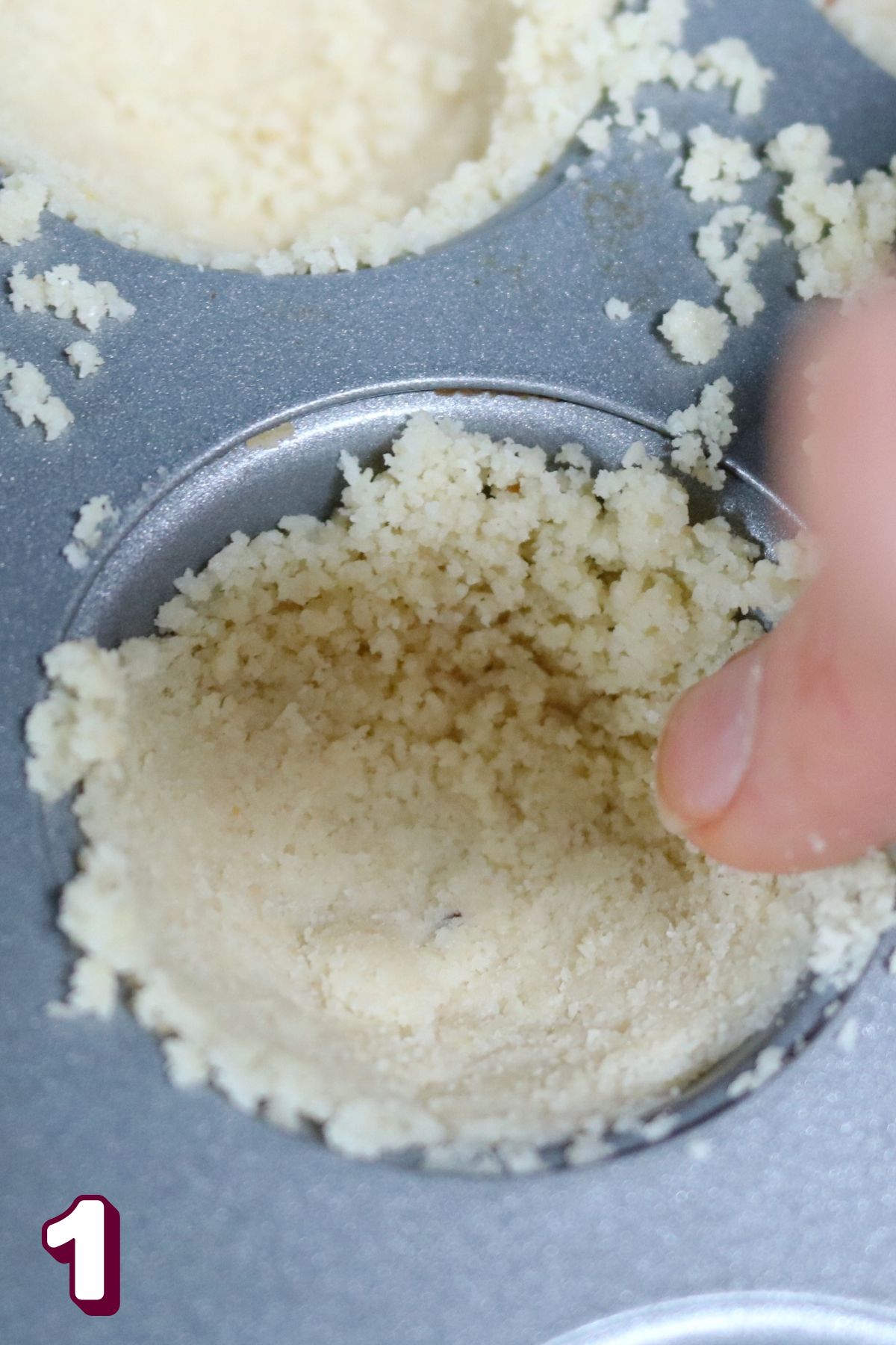 Almond flour crust in a mini muffin tin.
