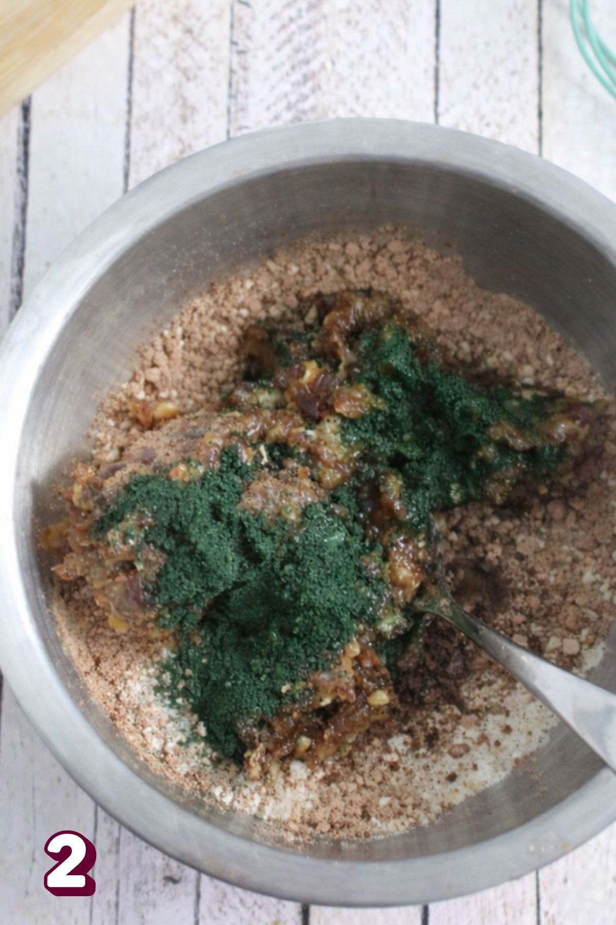 Spirulina energy ball mixture in a steel bowl.