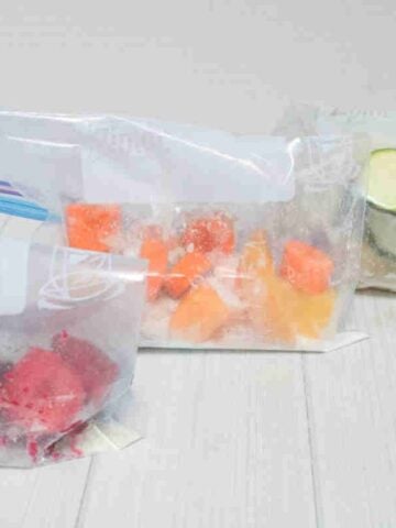 Three freezer smoothie packs lined up.