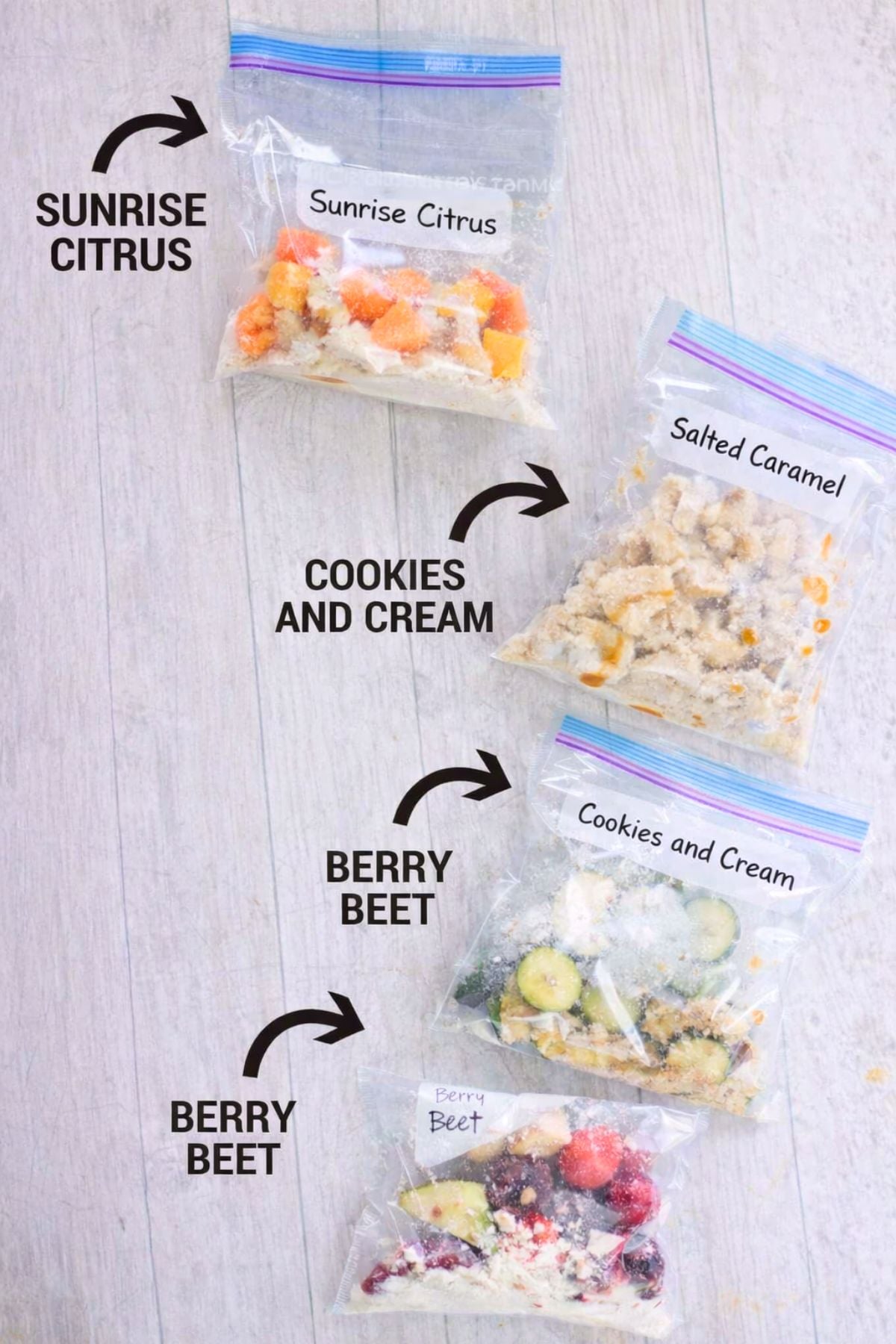 Four freezer smoothie bags with text labels on them of flavors.