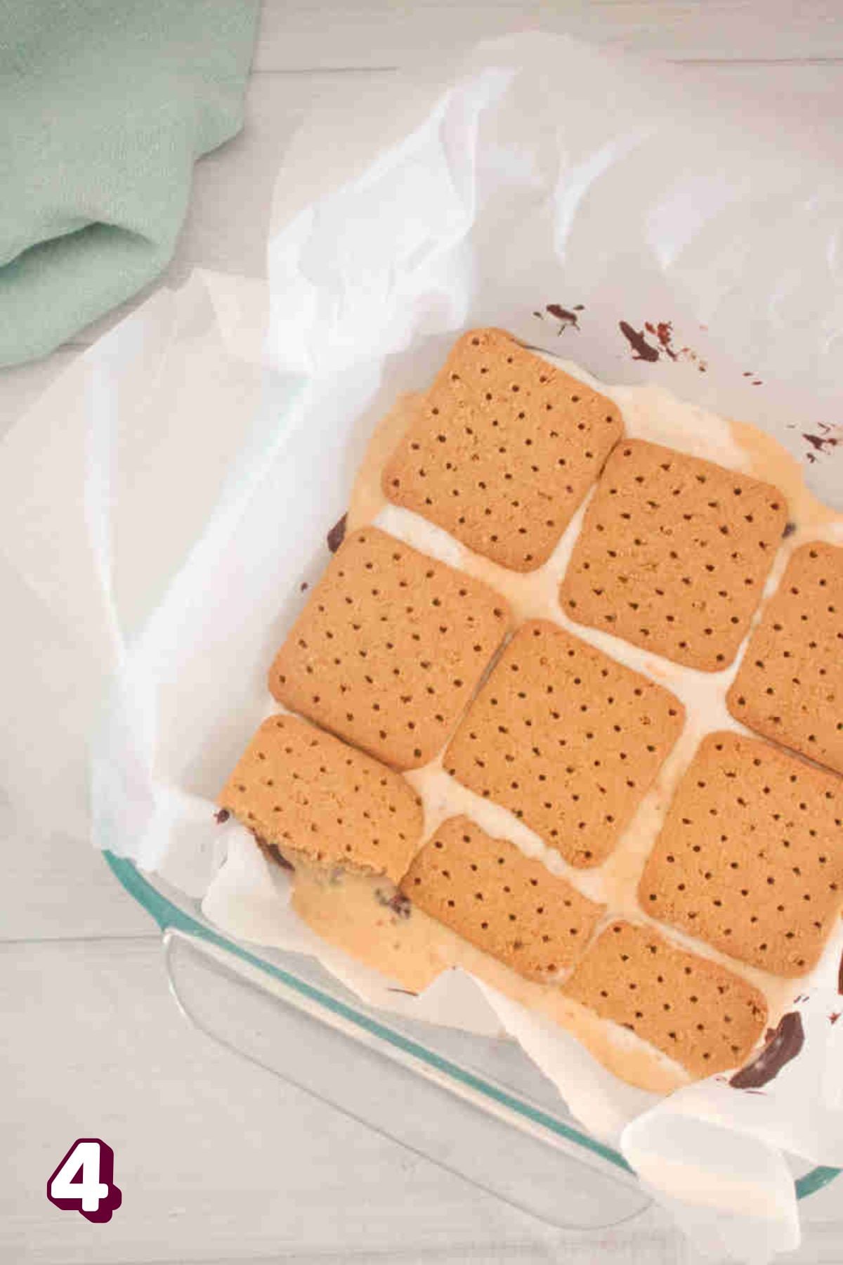 another layer of graham crackers placed on top of the filling mixture