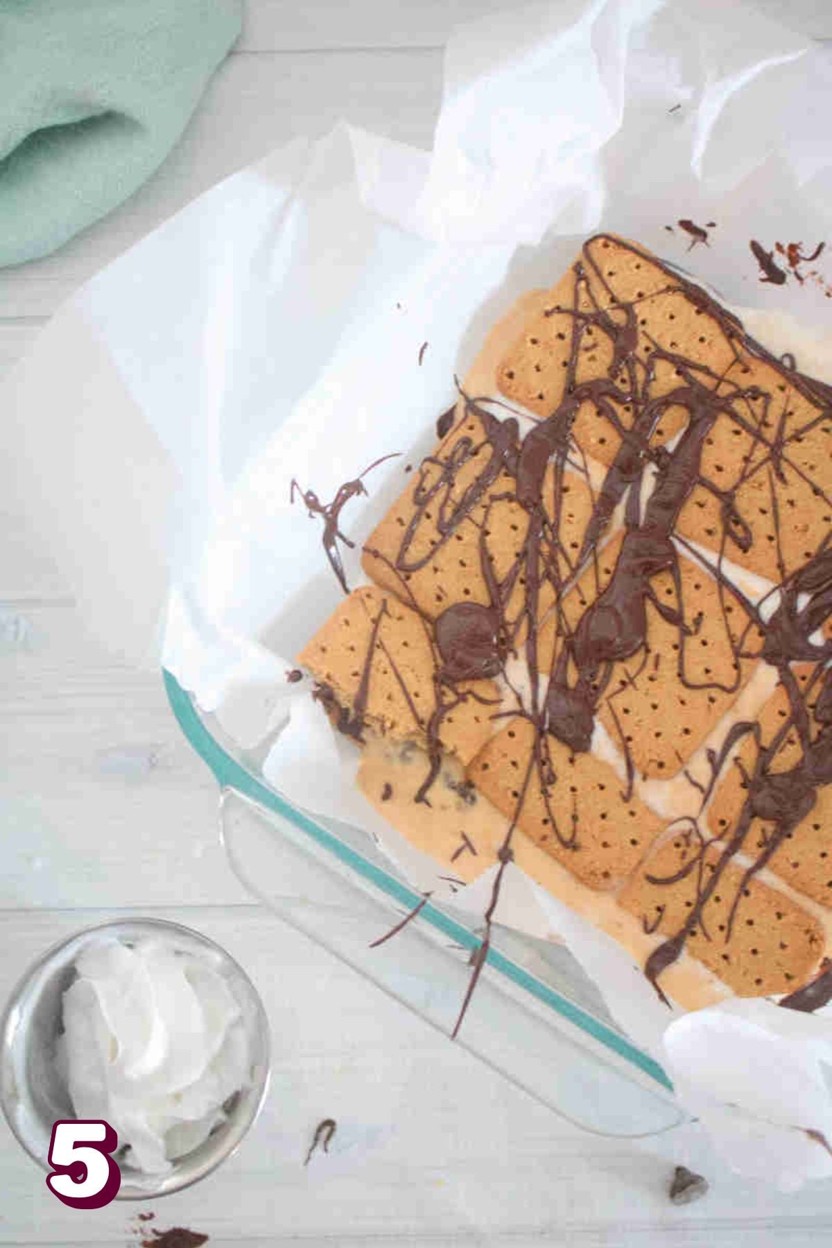 melted chocolate drizzled on top of the smores