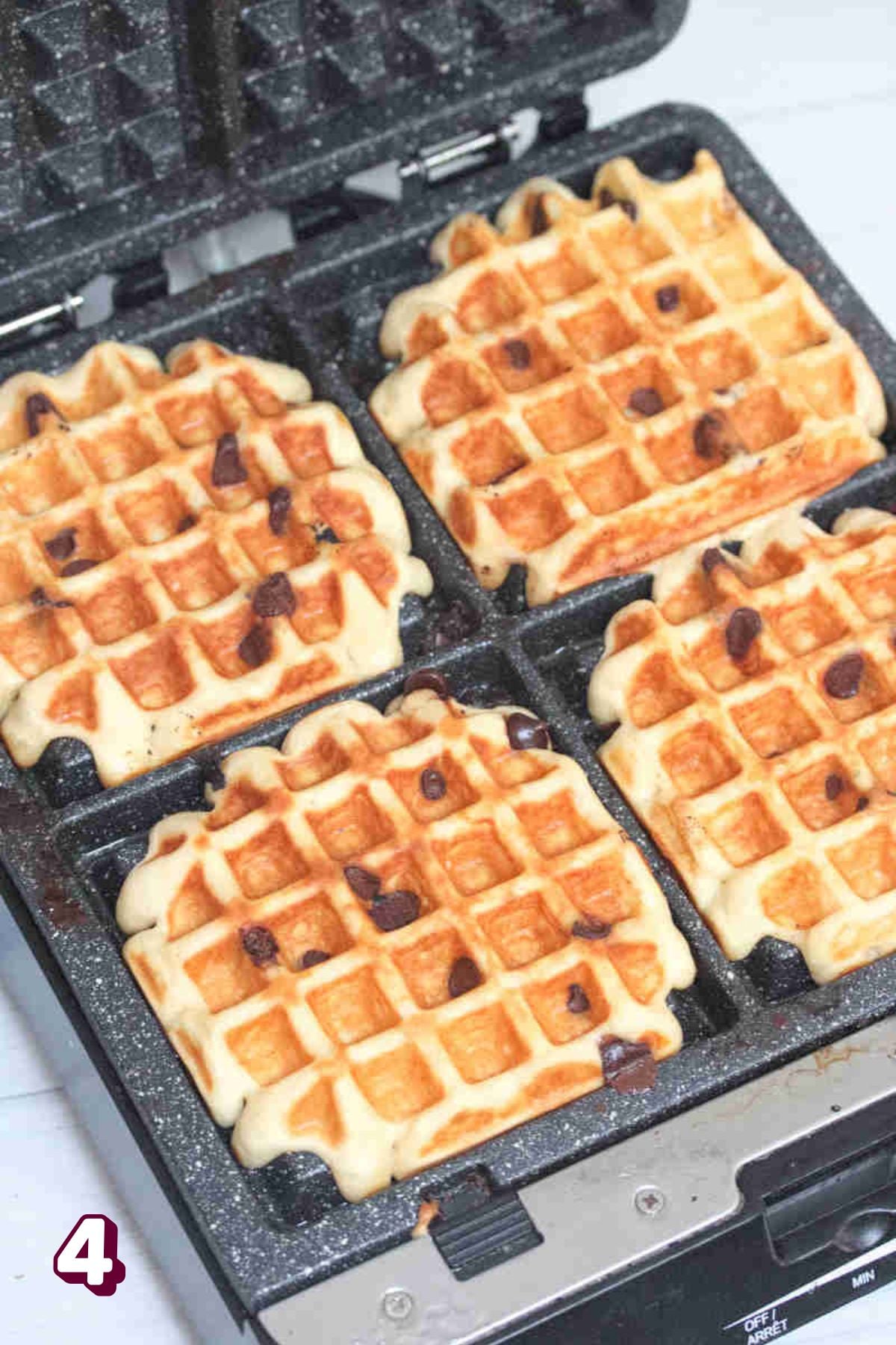 Chocolate chip blender waffles in a cast iron waffle iron.